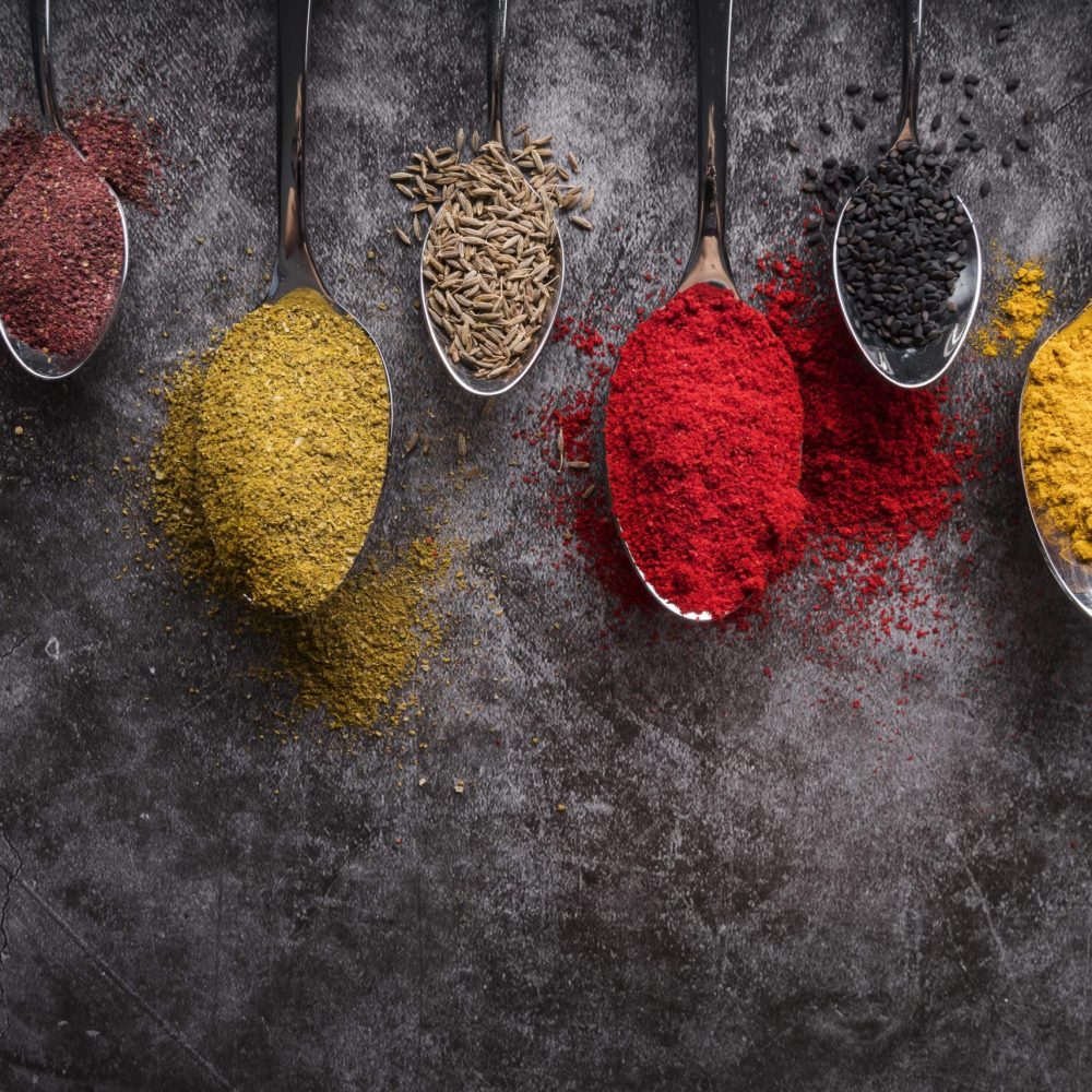 different-spoons-assortment-with-spices-min
