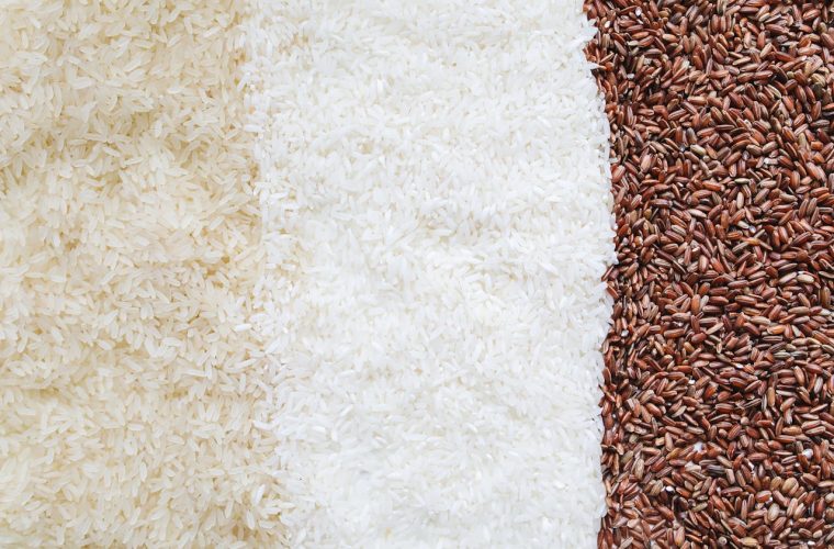 Three types of uncooked rice in a close-up still life arrangement.